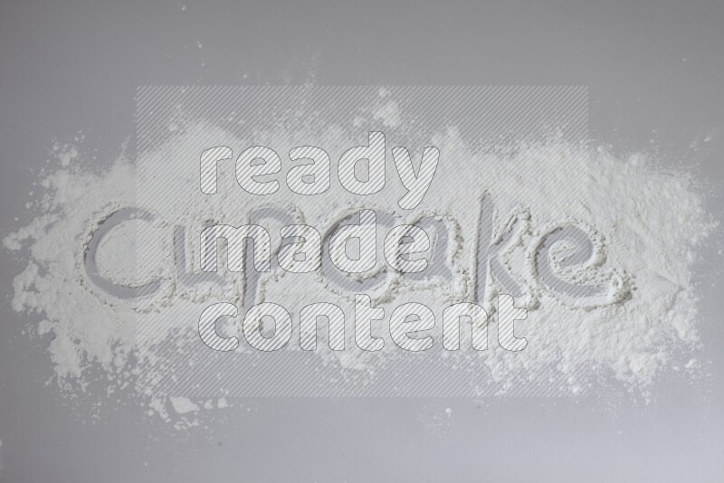 A word written with powder on grey background