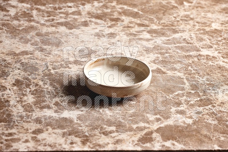 Beige Pottery Bowl on Beige Marble Flooring, 45 degrees