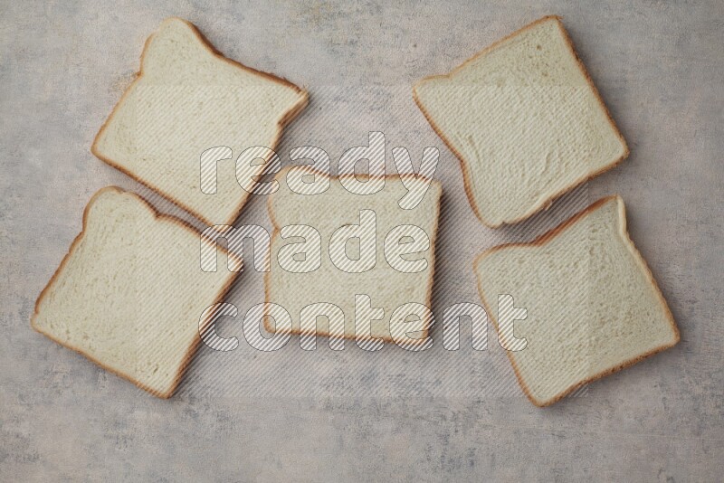 White Toast slices on alight blue textured background