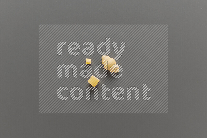 Different pasta types on grey background