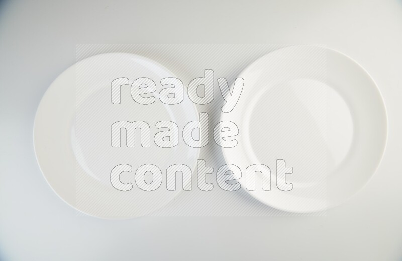 white and black plates on white background