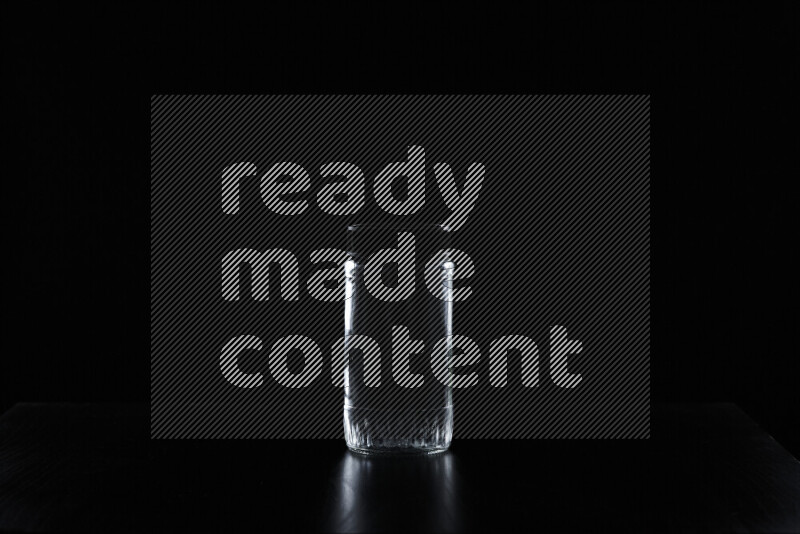 Glassware with rim light against black background