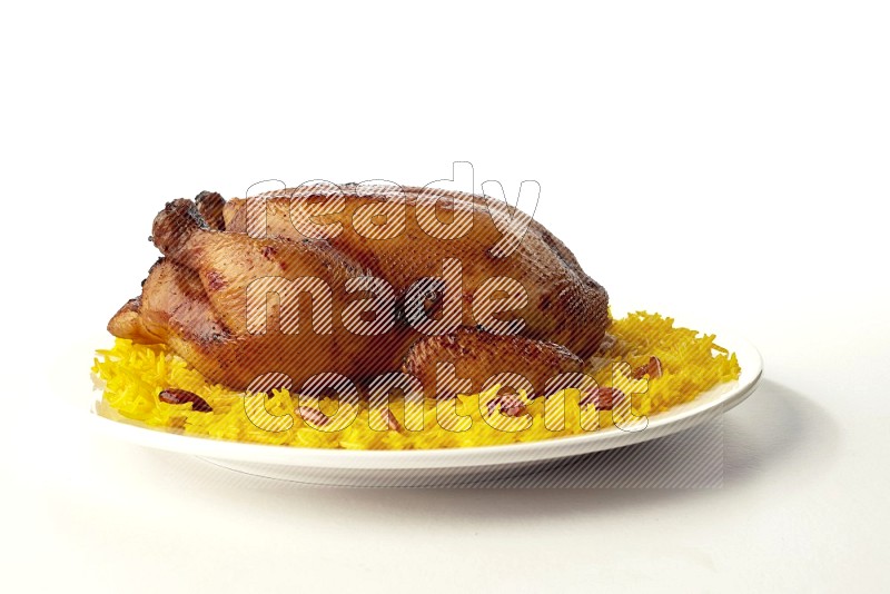 yellow  basmati Rice with  whole roasted chicken on a white rounded plate direct on white background