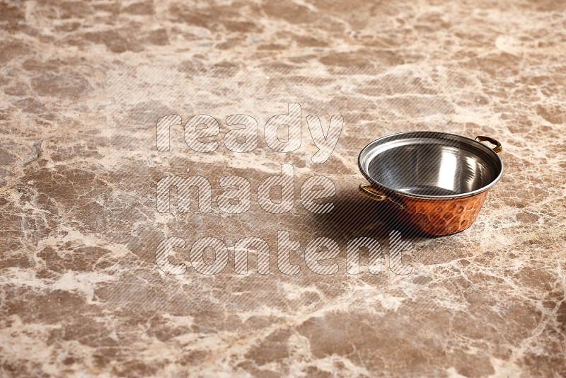 Small Copper Pot on Beige Marble Flooring, 45 degrees