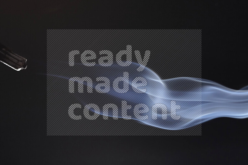 Motion of wavy smoke isolated on dark background