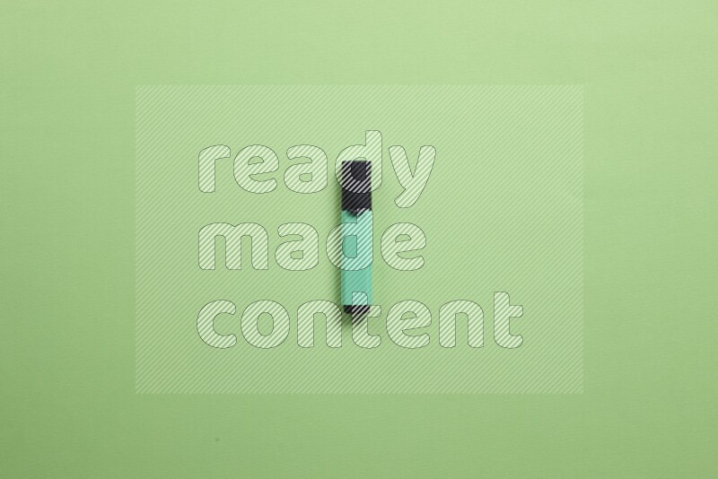 Multicolored highlighter pens on green background