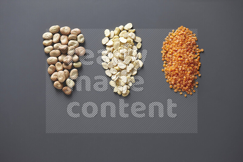 Bunches of legumes on grey background