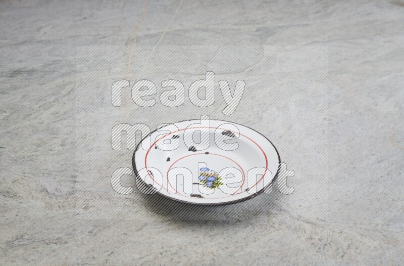 A vintage metal plate on grey marble background