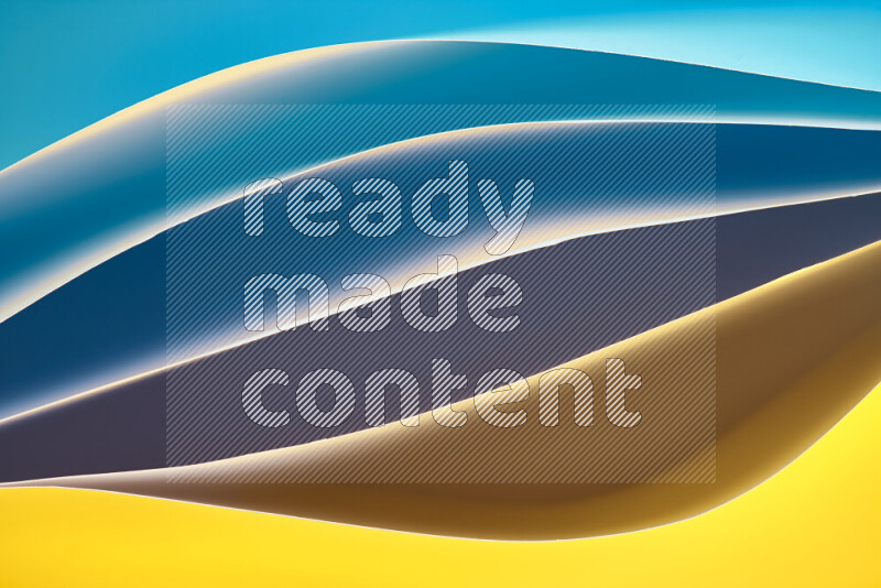 This image showcases an abstract paper art composition with paper curves in blue and yellow gradients created by colored light