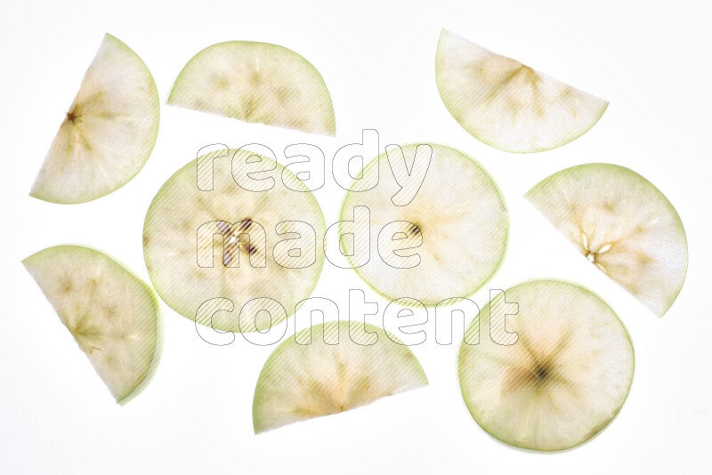 Apple slices on illuminated white background