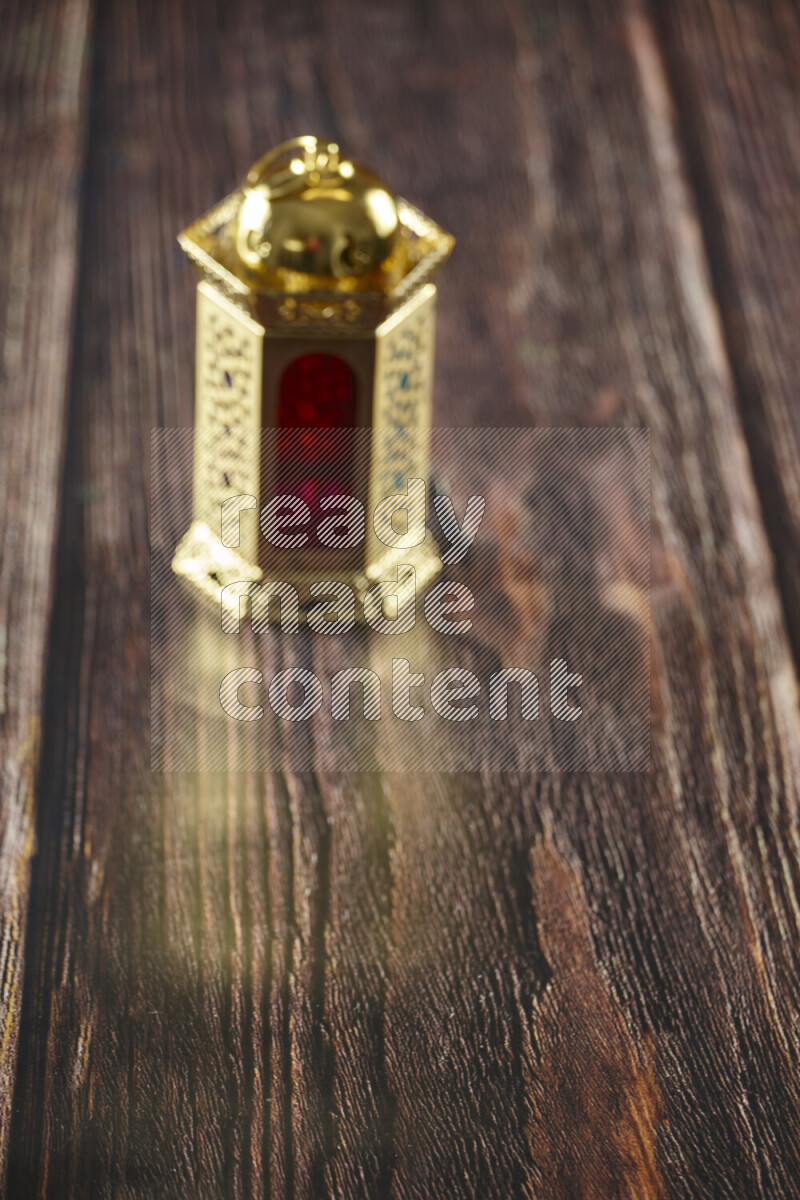 A lantern placed on a wooden background