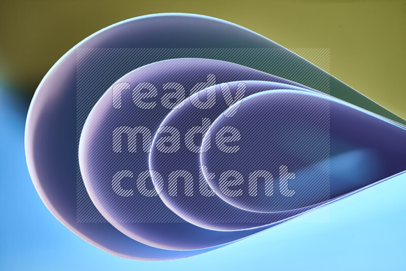 An abstract art of paper folded into smooth curves in blue and yellow gradients