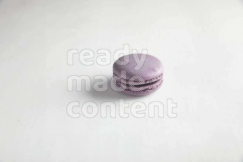 45º Shot of Purple Blueberry macaron on white background