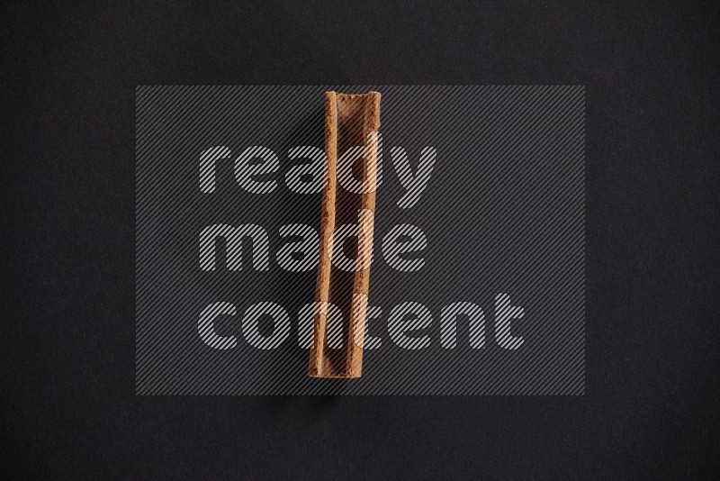Cinnamon stick on black background