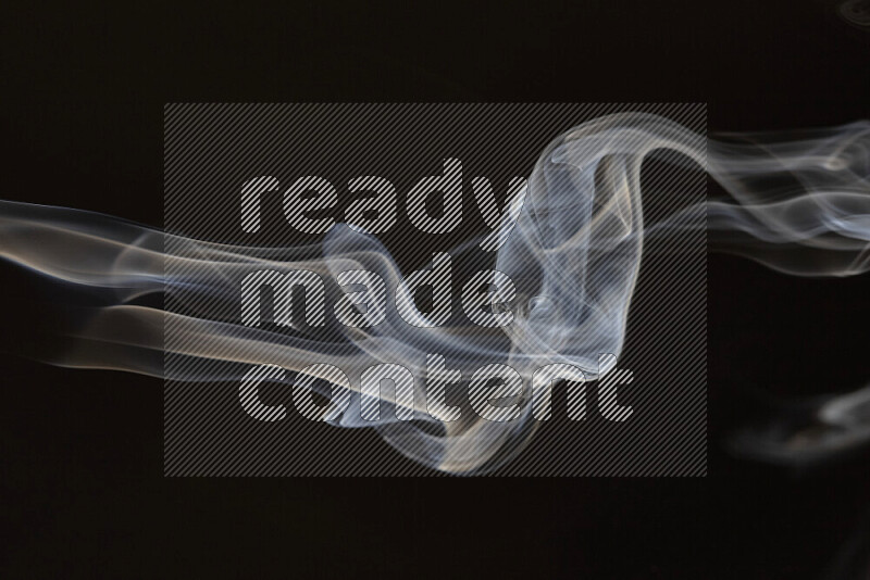 Motion of wavy smoke isolated on dark background