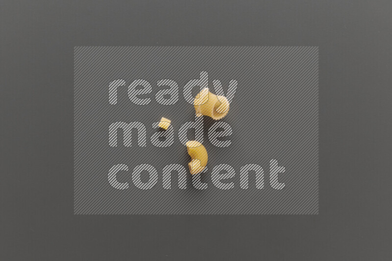 Different pasta types on grey background