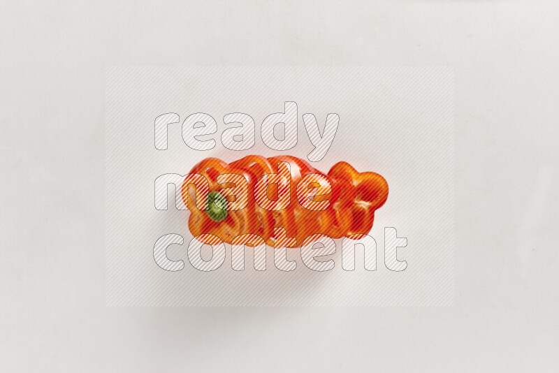 Red bell pepper slices on white background