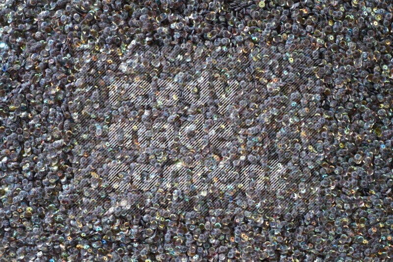 ترتر مسطح متعدد الألوان على خلفية رمادية