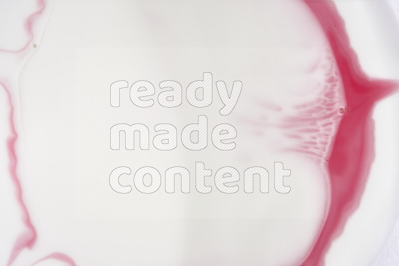 A close-up of abstract swirling patterns in red and white