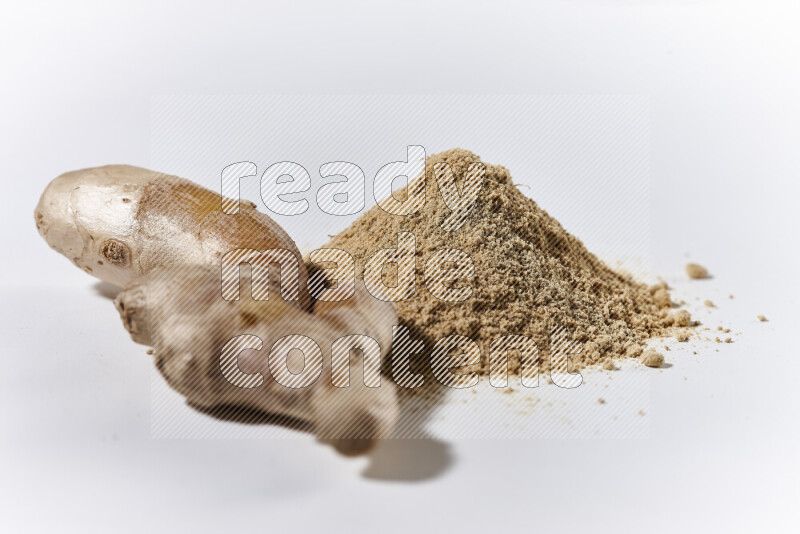 A bunch of ground ginger powder on white background