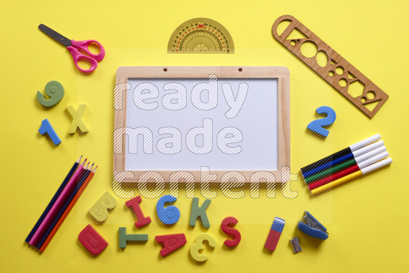 A whiteboard with different school supplies on yellow background