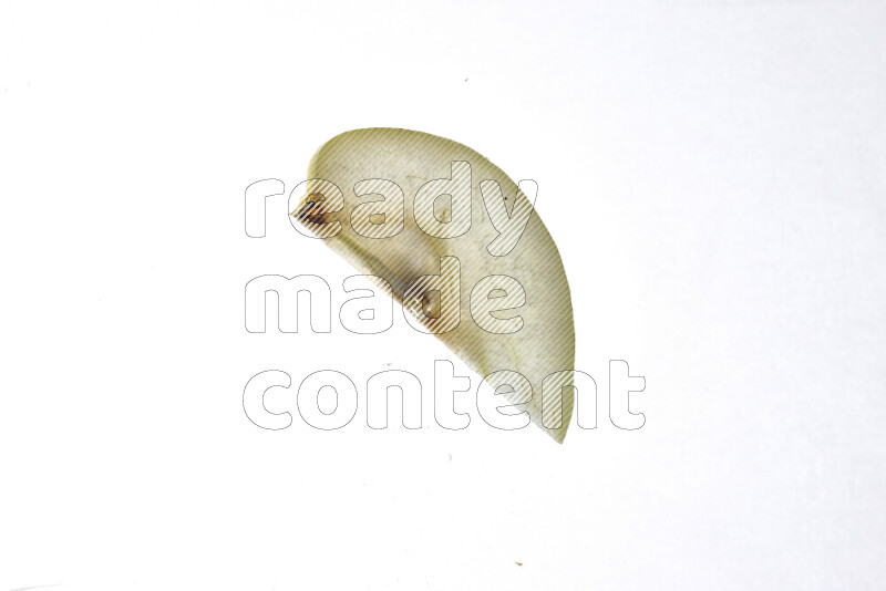 Pear slices on illuminated white background