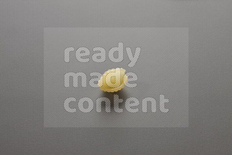 Shells pasta on grey background