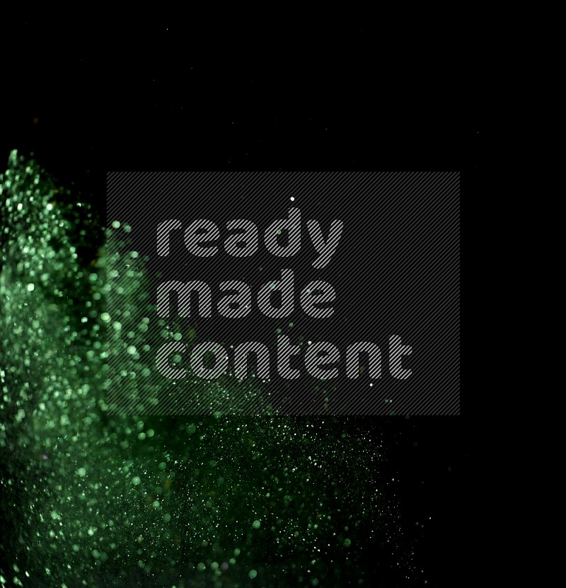 Green glitter powder isolated on black background