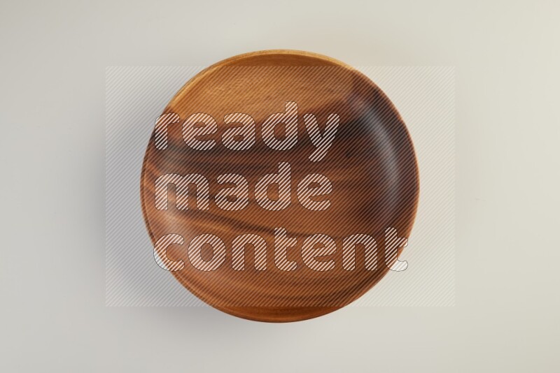 Wooden bowl and plate on white background