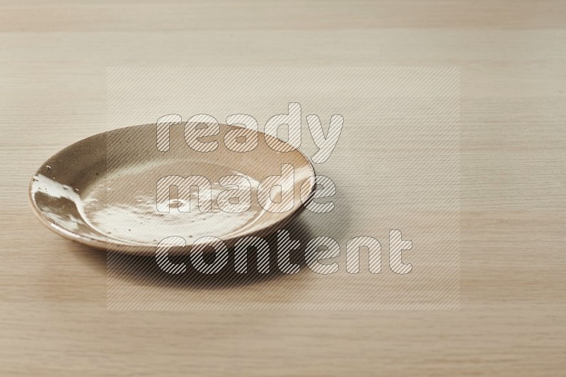 Beige Pottery Plate on Oak Wooden Flooring, 15 degrees