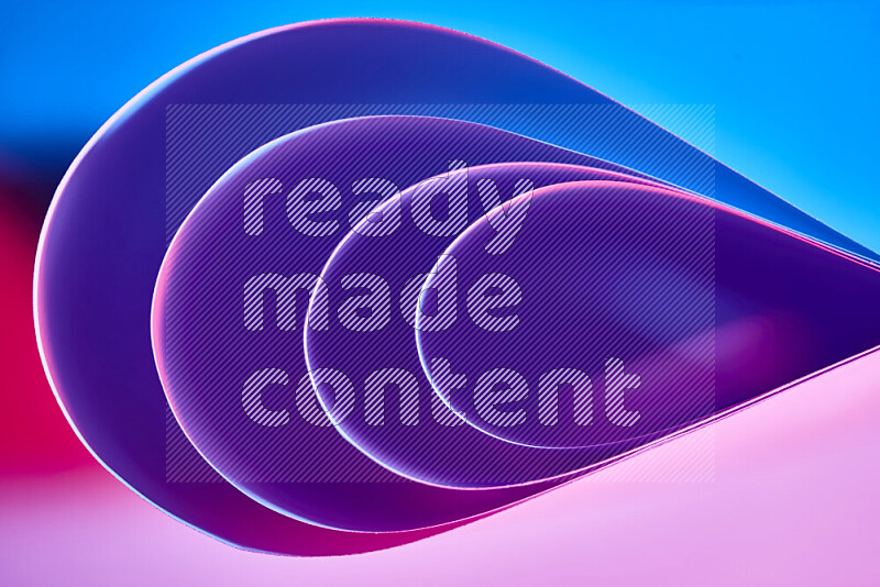 An abstract art of paper folded into smooth curves in blue, purple and red gradients