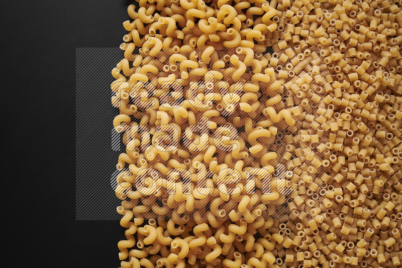 Different pasta types on black background