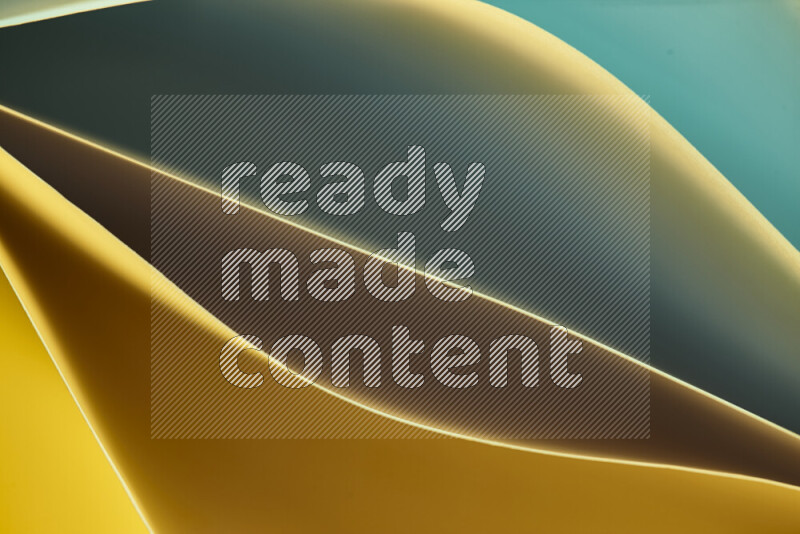 This image showcases an abstract paper art composition with paper curves in green and yellow gradients created by colored light