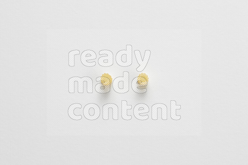 Small rings pasta on white background