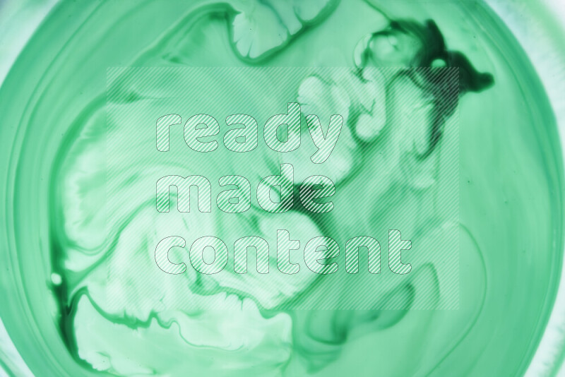 لقطة مقربة لأنماط دوامية بتدرجات اللون الأخضر