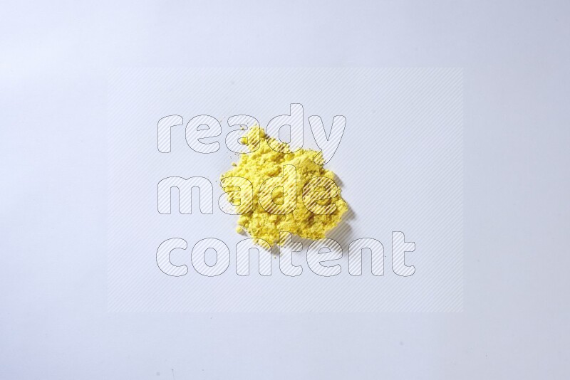 Yellow powder on white background