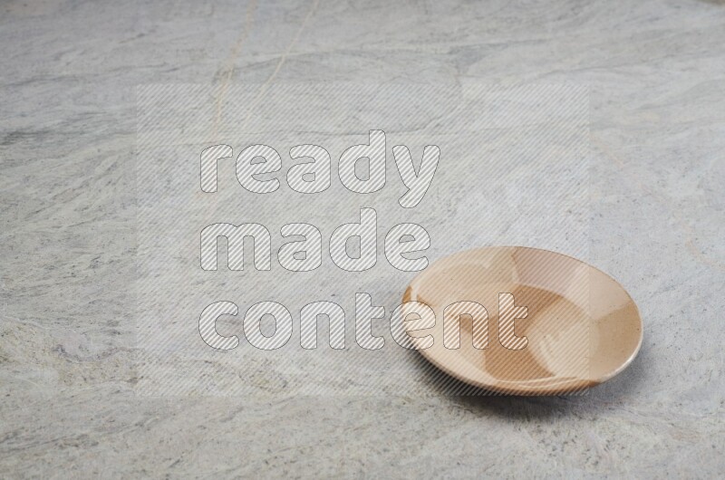 Multicolored Pottery Plate On Grey Marble Flooring