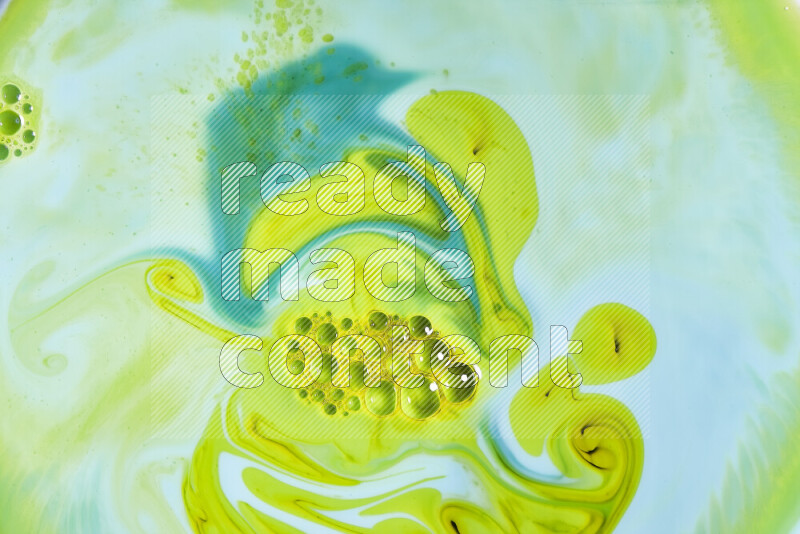 A close-up of abstract swirling patterns in green gradients