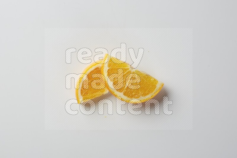 Two halves of an orange slices on white background