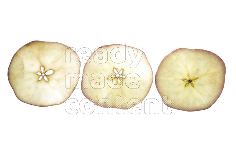 Apple slices on illuminated white background