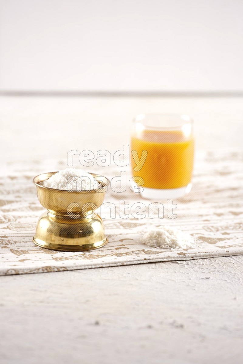 Dried fruits in a metal bowl with qamar eldin in a light setup