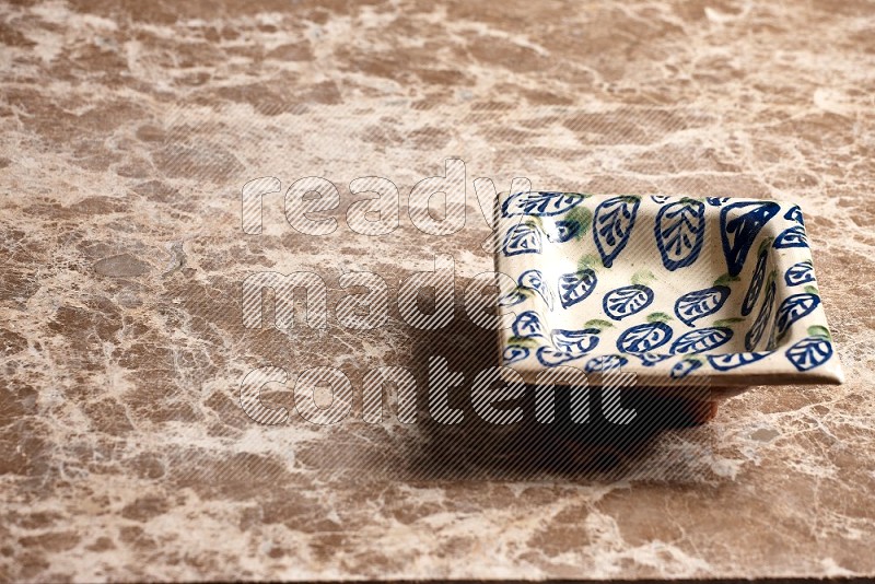 Decorative Pottery Plate on Beige Marble Flooring