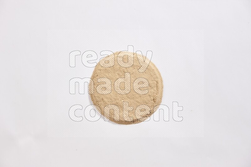Garlic powder in a circle shape on a white flooring