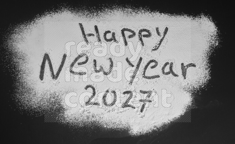 A sentence written with powder on black background