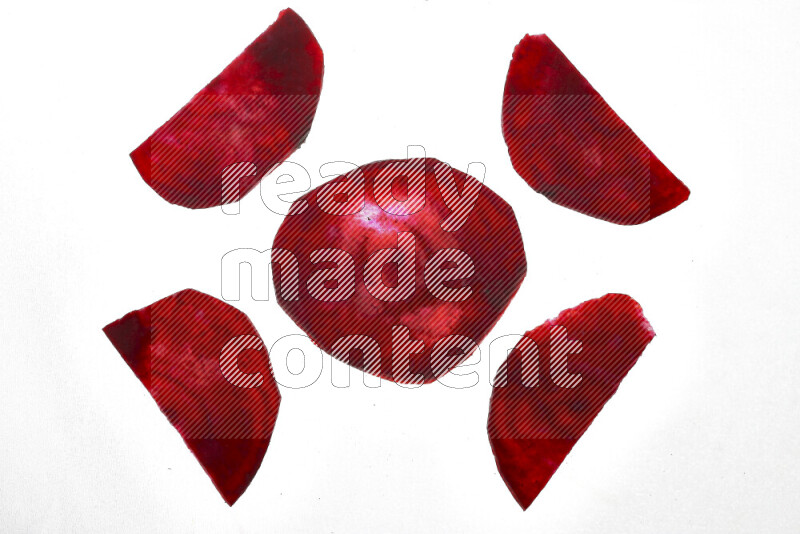 Beet slices on illuminated white background