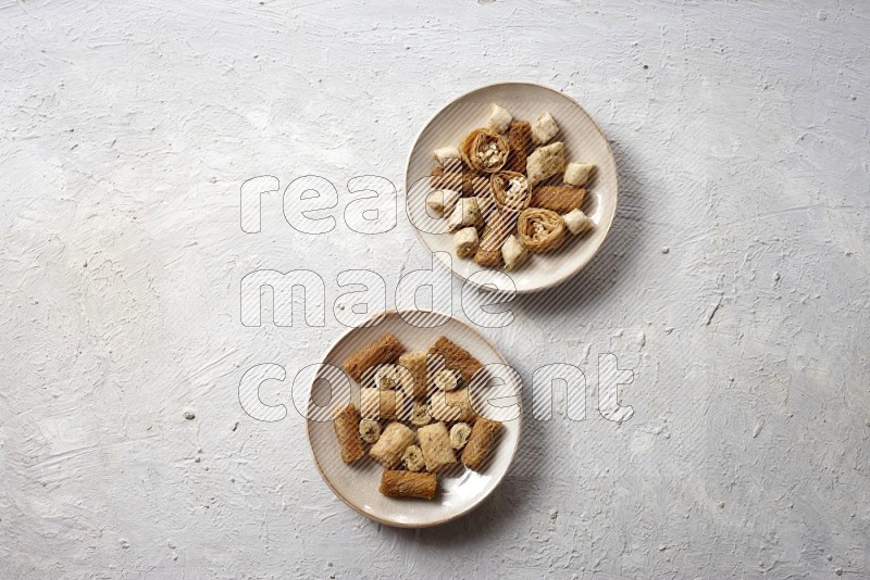 Oriental sweets in pottery plates in a light setup