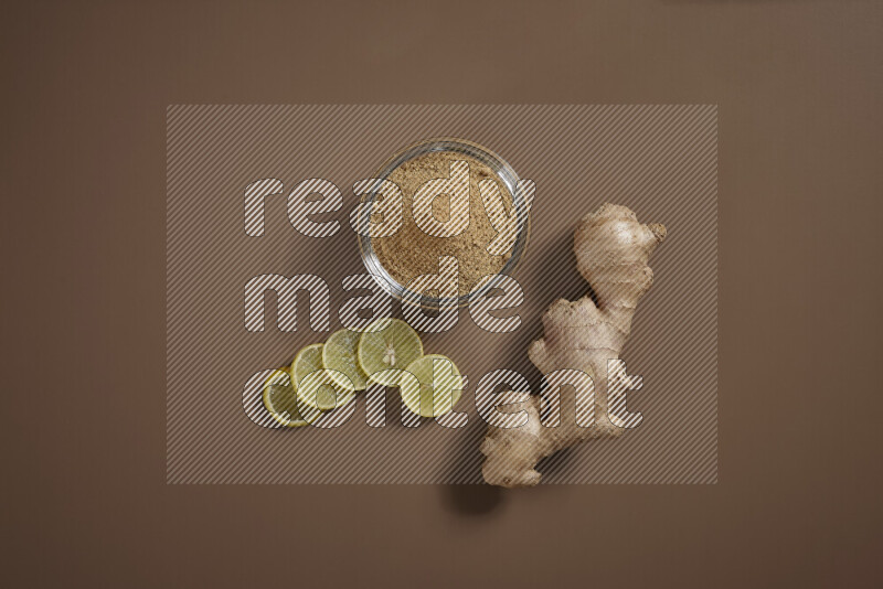 Fresh ginger root with different ingredients such as lemon, orange, honey, ground ginger on beige baackground