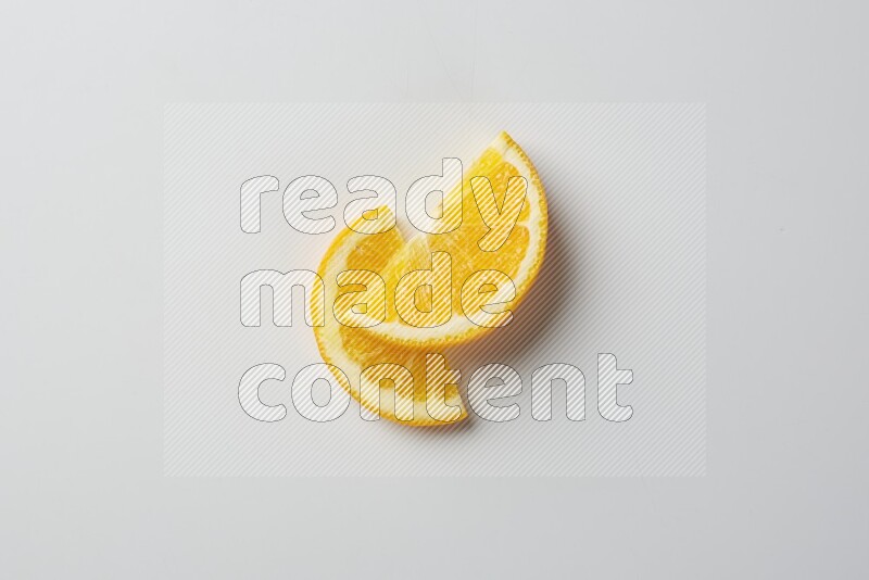Two halves of an orange slices on white background