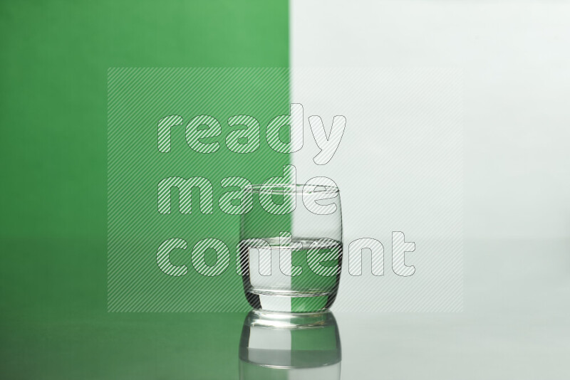 The image features a clear glassware filled with water, set against white and green background