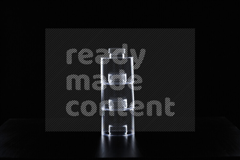 Glassware with rim light against black background